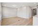 Bright and spacious living room featuring modern wood floors and recessed lighting at 5290 Citrus Leaf Blvd, Winter Garden, FL 34787