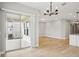Open living space featuring hardwood floors, leading to a covered patio with sliding glass doors at 5290 Citrus Leaf Blvd, Winter Garden, FL 34787