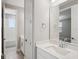 Bathroom features a single vanity with a rectangular mirror and tiled floors at 5307 Citrus Leaf Blvd, Winter Garden, FL 34787