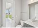 Clean bathroom featuring a toilet, sink with vanity, and a walk-out door to patio at 5307 Citrus Leaf Blvd, Winter Garden, FL 34787