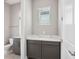 Modern bathroom with a vanity featuring a white countertop and gray cabinets at 5307 Citrus Leaf Blvd, Winter Garden, FL 34787