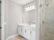 Beautiful bathroom featuring a white vanity, shower with tile, and stylish lighting at 5307 Citrus Leaf Blvd, Winter Garden, FL 34787