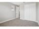 Bright bedroom featuring neutral walls, plush carpeting, and a spacious closet at 5307 Citrus Leaf Blvd, Winter Garden, FL 34787