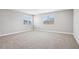Spacious bedroom featuring plush carpeting and bright natural light from large windows at 5307 Citrus Leaf Blvd, Winter Garden, FL 34787