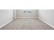 Cozy bedroom with neutral carpet, a window, and white trim at 5307 Citrus Leaf Blvd, Winter Garden, FL 34787