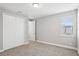 Bedroom featuring neutral walls, carpet flooring, and a double-door closet at 5307 Citrus Leaf Blvd, Winter Garden, FL 34787