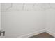 Walk-in closet with white wire shelving and neutral carpeting provides organized storage at 5307 Citrus Leaf Blvd, Winter Garden, FL 34787