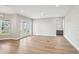 Spacious living room with light hardwood floors, ample natural light, and a wet bar at 5307 Citrus Leaf Blvd, Winter Garden, FL 34787