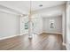Open living area with abundant natural light, wood-look floors, and modern lighting at 5307 Citrus Leaf Blvd, Winter Garden, FL 34787