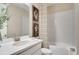 Well-lit bathroom featuring a modern vanity with a white countertop and a shower-tub combination at 545 Moon Shell Cir, New Smyrna Beach, FL 32168