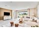 Comfortable living room with a plush white sofa, textured rug, and a view of the outdoor space at 545 Moon Shell Cir, New Smyrna Beach, FL 32168