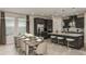 Open concept with large dining room table flowing into kitchen island with seating at 548 Moon Shell Cir, New Smyrna Beach, FL 32168