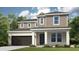 Charming two-story home with a well-manicured lawn, gray siding, and attached two car garage at 548 Moon Shell Cir, New Smyrna Beach, FL 32168