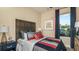 Cozy bedroom featuring nautical decor, a decorative headboard, and a comfortable bed at 556 Moon Shell Cir, New Smyrna Beach, FL 32168
