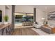 Bright living room with sliding glass doors that open to a private pool and outdoor dining area at 556 Moon Shell Cir, New Smyrna Beach, FL 32168