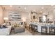 Open concept living space with a kitchen island, stainless appliances, and comfortable seating at 556 Moon Shell Cir, New Smyrna Beach, FL 32168