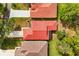 Aerial view of terracotta tile roofs, showcasing the home's unique roofline and surrounding neighborhood at 7 Forest Ln, Eustis, FL 32726