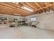 Unfinished basement with concrete walls, shelving, and ample storage space at 7 Forest Ln, Eustis, FL 32726