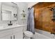 Modern bathroom features sleek vanity, tiled shower, and decor accents at 7 Forest Ln, Eustis, FL 32726