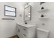 Bathroom features modern black fixtures, a sleek vanity, and floating shelves at 7 Forest Ln, Eustis, FL 32726