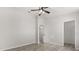 Bright and spacious bedroom with wood-look floors, and direct access to a bathroom at 7 Forest Ln, Eustis, FL 32726