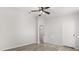 Bright bedroom featuring a ceiling fan and light hardwood flooring at 7 Forest Ln, Eustis, FL 32726