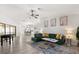 Open concept living room with modern decor, hardwood floors, and view of kitchen at 7 Forest Ln, Eustis, FL 32726