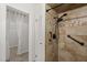 Upgraded shower features tile surround, rainfall shower head, and grab bar at 7 Forest Ln, Eustis, FL 32726