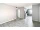 Spacious living room with sleek gray flooring leading to a modern kitchen with stainless steel appliances at 734 Michigan Ct # 2, St Cloud, FL 34769