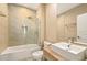 Modern bathroom featuring a shower with glass door, tile accent wall, and stylish square sink at 7513 Brooklyn Dr, Kissimmee, FL 34747