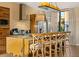 Bright kitchen features a large island with seating, stainless steel appliances, and modern lighting fixtures at 7513 Brooklyn Dr, Kissimmee, FL 34747