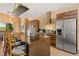 Modern kitchen features sleek cabinetry, stainless steel appliances, and a large island with bar seating at 7513 Brooklyn Dr, Kissimmee, FL 34747