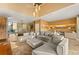 Bright and open living area features modern furniture, stylish decor, and seamless connection to the kitchen at 7513 Brooklyn Dr, Kissimmee, FL 34747