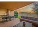 Outdoor patio with barbecue area, dining set, and comfortable lounge seating for outdoor relaxation at 7513 Brooklyn Dr, Kissimmee, FL 34747