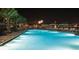 Inviting swimming pool with lounge seating and festive fireworks display at night at 7513 Brooklyn Dr, Kissimmee, FL 34747
