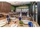 Elegant restaurant with wood accents, moss-covered walls, and beautifully set tables at 7513 Brooklyn Dr, Kissimmee, FL 34747
