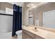 Traditional bathroom with combination tub and shower at 7672 Torino Ct, Orlando, FL 32835