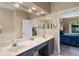 Bathroom featuring a double sink vanity and neutral decor at 7672 Torino Ct, Orlando, FL 32835