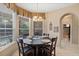 Charming breakfast nook with bay window and view of the outdoor area at 7672 Torino Ct, Orlando, FL 32835