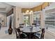 Breakfast nook with backyard views and modern lighting at 7672 Torino Ct, Orlando, FL 32835
