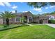 Charming home features a tile roof, manicured lawn and two car garage at 7672 Torino Ct, Orlando, FL 32835