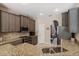 Well-equipped kitchen with granite counters, stainless appliances, and ample cabinetry at 7672 Torino Ct, Orlando, FL 32835