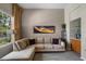 Comfortable living room with large window and neutral color palette at 7672 Torino Ct, Orlando, FL 32835