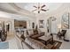 Spacious living room with open floor plan, recessed lights, and neutral tones at 7672 Torino Ct, Orlando, FL 32835