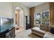 Comfortable living room with large window and neutral color palette at 7672 Torino Ct, Orlando, FL 32835