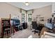 Dedicated home office space with multiple work stations, arcade game and natural light at 7672 Torino Ct, Orlando, FL 32835