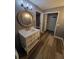 Updated bathroom featuring new vanity and modern floors and light fixtures at 811 Fairview Ave, Altamonte Springs, FL 32701