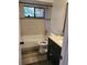 Bathroom with light tile in tub/shower surround and dark wood vanity at 811 Fairview Ave, Altamonte Springs, FL 32701