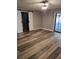 Bright bedroom featuring barn doors, modern flooring and a large sliding door at 811 Fairview Ave, Altamonte Springs, FL 32701