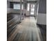 Bright entryway with modern flooring, leading into a spacious living area with lots of natural light at 811 Fairview Ave, Altamonte Springs, FL 32701